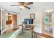 Bright office space with hardwood floors, ceiling fan, and French doors leading to the kitchen at 5818 N 3Rd Ave, Phoenix, AZ 85013