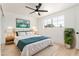 Serene bedroom with a ceiling fan, large window, and minimalist decor at 6813 E Diamond St, Scottsdale, AZ 85257