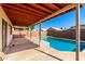 Backyard swimming pool, covered patio, wood fencing at 8339 W Elm St, Phoenix, AZ 85037