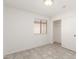 Neutral bedroom with tile flooring, natural light, and closet at 8339 W Elm St, Phoenix, AZ 85037