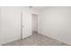 Bright bedroom with tile flooring and adjoining door to another room at 8339 W Elm St, Phoenix, AZ 85037