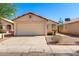Charming single-story home with a well-maintained lawn and a two-car garage on a clear day at 8339 W Elm St, Phoenix, AZ 85037