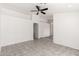 Bright living room with tile flooring, neutral paint, and a ceiling fan for comfortable living at 8339 W Elm St, Phoenix, AZ 85037