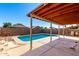 Covered patio with view of backyard pool and privacy wall offers great outdoor living space at 8339 W Elm St, Phoenix, AZ 85037