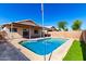 Inviting backyard pool with cool blue water, surrounded by concrete patio and block wall for privacy at 8339 W Elm St, Phoenix, AZ 85037