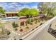 Charming backyard oasis with a pool, lush landscaping, and vibrant bougainvillea at 9780 E Gamble Ln, Scottsdale, AZ 85262