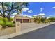 Lovely home exterior boasting a well-manicured yard with desert landscaping and a paver driveway at 9780 E Gamble Ln, Scottsdale, AZ 85262
