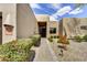 Beautiful front entrance with desert landscaping and a charming courtyard at 9780 E Gamble Ln, Scottsdale, AZ 85262