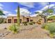 Charming desert home with a well-kept yard, native plants, and a three car garage at 9780 E Gamble Ln, Scottsdale, AZ 85262