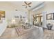 Spacious living room boasting high ceilings, modern decor, light hardwood floors, and seamless indoor-outdoor flow at 9780 E Gamble Ln, Scottsdale, AZ 85262