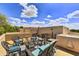 Desert home patio with comfortable seating area and beautiful blue sky at 9780 E Gamble Ln, Scottsdale, AZ 85262