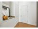 Apartment entryway featuring a decorative mirror and convenient storage space at 1 E Lexington Ave # 302, Phoenix, AZ 85012