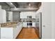 Modern kitchen with stainless steel appliances and granite countertops, perfect for culinary enthusiasts at 1 E Lexington Ave # 302, Phoenix, AZ 85012