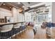 Open living space featuring a breakfast bar, living room, and dining area at 1 E Lexington Ave # 302, Phoenix, AZ 85012