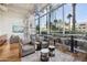 Bright lounge area with comfortable seating and floor-to-ceiling windows and scenic city views at 1 E Lexington Ave # 302, Phoenix, AZ 85012