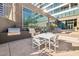 A modern outdoor kitchen area features built-in grills and a seating area perfect for entertaining at 1 E Lexington Ave # 302, Phoenix, AZ 85012
