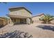 Spacious backyard featuring a covered patio and low-maintenance gravel landscaping at 1079 E Jasper Dr, Gilbert, AZ 85296