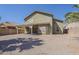 Expansive backyard with covered patio and neutral-toned exterior, perfect for outdoor living at 1079 E Jasper Dr, Gilbert, AZ 85296