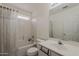 Well-maintained bathroom with a shower-tub combo, vanity sink, and neutral color scheme at 1079 E Jasper Dr, Gilbert, AZ 85296