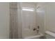 Neat bathroom features shower-tub combination, vanity sink, and white finishes at 1079 E Jasper Dr, Gilbert, AZ 85296