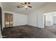 This bedroom features neutral paint, carpet, and an en suite bathroom at 1079 E Jasper Dr, Gilbert, AZ 85296