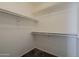 Walk-in closet with carpeted floors, bright walls, and white metal poles and shelves for storage at 1079 E Jasper Dr, Gilbert, AZ 85296