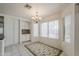 Bright dining area featuring tile floors, large windows, custom cabinetry and an elegant chandelier at 1079 E Jasper Dr, Gilbert, AZ 85296