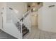 Impressive home entryway with staircase, neutral walls, and tiled flooring at 1079 E Jasper Dr, Gilbert, AZ 85296