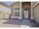 Inviting front entrance with a decorative door, complemented by a low-maintenance, landscaped yard at 1079 E Jasper Dr, Gilbert, AZ 85296