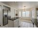 Well-lit kitchen and breakfast nook boasting stainless steel appliances and tiled flooring at 1079 E Jasper Dr, Gilbert, AZ 85296