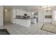 Open-concept kitchen features stainless steel appliances, granite countertops and access to a dining area at 1079 E Jasper Dr, Gilbert, AZ 85296