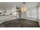 Open-concept living room leading to a kitchen and dining area, great for entertaining guests at 1079 E Jasper Dr, Gilbert, AZ 85296