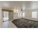 Inviting living room with sliding glass doors, lots of windows, and plush carpeting at 1079 E Jasper Dr, Gilbert, AZ 85296