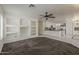 Bright living space with built-in shelving and an open layout connecting to the kitchen at 1079 E Jasper Dr, Gilbert, AZ 85296