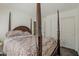 Serene main bedroom featuring a large bed, sliding closet doors and 4 poster bed at 1079 E Jasper Dr, Gilbert, AZ 85296