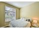 Bedroom featuring a large window and soft lighting at 11640 N Tatum Blvd # 1095, Phoenix, AZ 85028