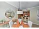 Open concept dining space featuring a round table, stylish lighting, and a view into kitchen at 11640 N Tatum Blvd # 1095, Phoenix, AZ 85028
