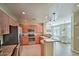 A contemporary kitchen with stainless steel appliances, granite counters, and eat-in breakfast area at 11640 N Tatum Blvd # 1095, Phoenix, AZ 85028