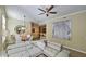 Open-concept living room showcasing modern decor, a dining area, and a breakfast bar, perfect for entertaining at 11640 N Tatum Blvd # 1095, Phoenix, AZ 85028