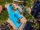 Community pool and spa surrounded by lush landscaping and lounge chairs at 11640 N Tatum Blvd # 1095, Phoenix, AZ 85028