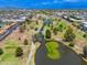 Aerial view showcases a large park with walking trails, ponds, and green spaces, ideal for outdoor activities at 1217 N Miller Rd # 23, Scottsdale, AZ 85257