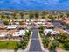 Beautiful aerial view of community with lush landscaping, swimming pool, and well-maintained residences at 1217 N Miller Rd # 23, Scottsdale, AZ 85257