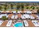Overhead shot captures the residential area with a clear view of the community pool and surrounding landscape at 1217 N Miller Rd # 23, Scottsdale, AZ 85257