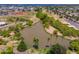 Scenic overhead shot of a lake framed by lush trees, offering a tranquil and picturesque setting at 1217 N Miller Rd # 23, Scottsdale, AZ 85257
