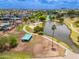 Aerial shot of a community park featuring shaded picnic areas, walking paths, and a serene lake for outdoor enjoyment at 1217 N Miller Rd # 23, Scottsdale, AZ 85257