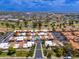 Scenic aerial shot showcases the community with nearby lake and green spaces, enhancing the neighborhood's charm at 1217 N Miller Rd # 23, Scottsdale, AZ 85257