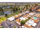 Wide aerial view of the neighborhood featuring well-maintained homes, a community pool, and nearby recreational areas at 1217 N Miller Rd # 23, Scottsdale, AZ 85257