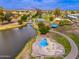 Aerial photo of a community splash pad, lake, and park with picnic spots providing a fun and relaxing atmosphere at 1217 N Miller Rd # 23, Scottsdale, AZ 85257