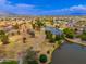Aerial shot of a community featuring walking paths, a lake, and green spaces, ideal for outdoor activities and relaxation at 1217 N Miller Rd # 23, Scottsdale, AZ 85257