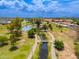 Picturesque aerial shot of a lake, framed by lush green parkland, perfect for outdoor relaxation at 1217 N Miller Rd # 23, Scottsdale, AZ 85257